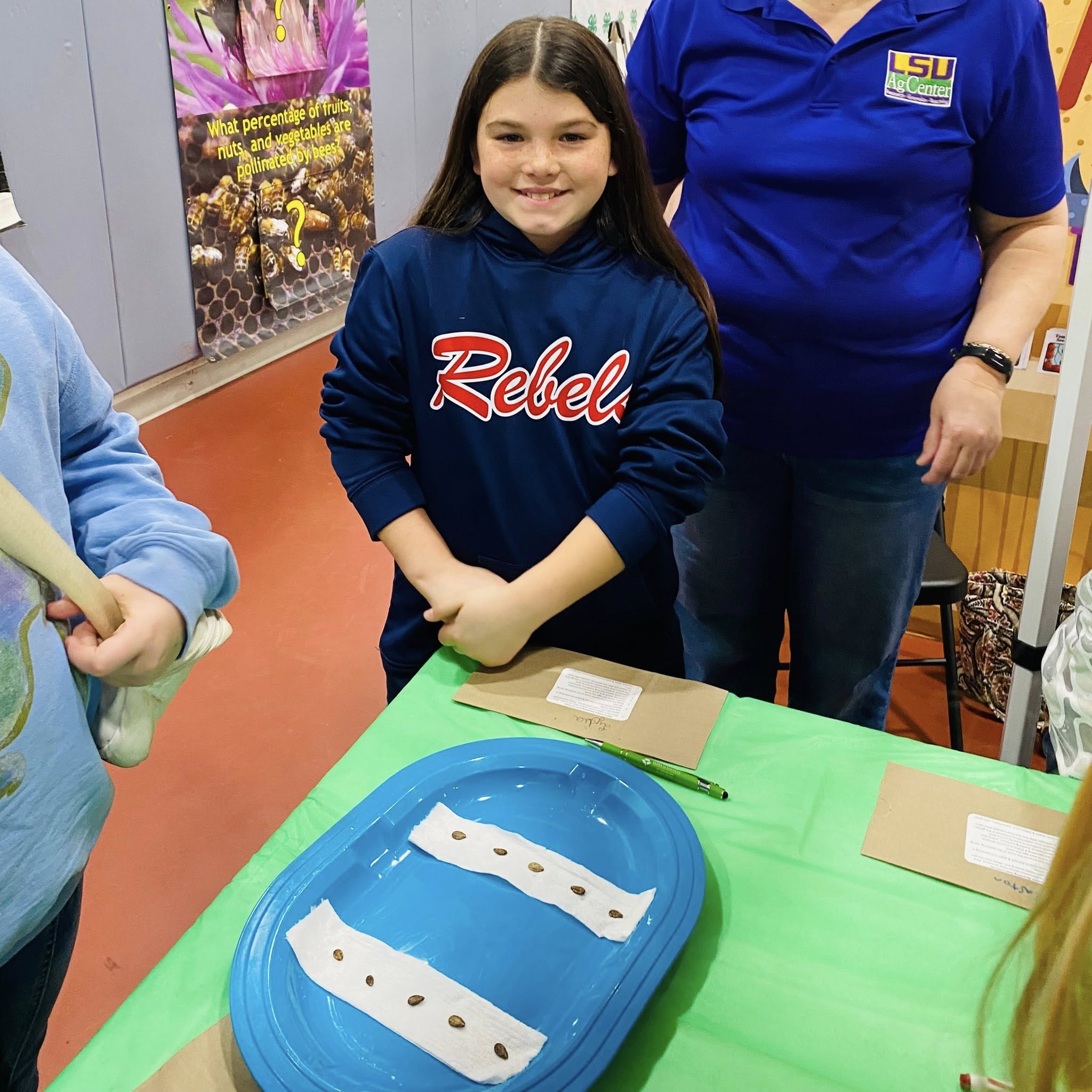 A girl smiling for a picture.